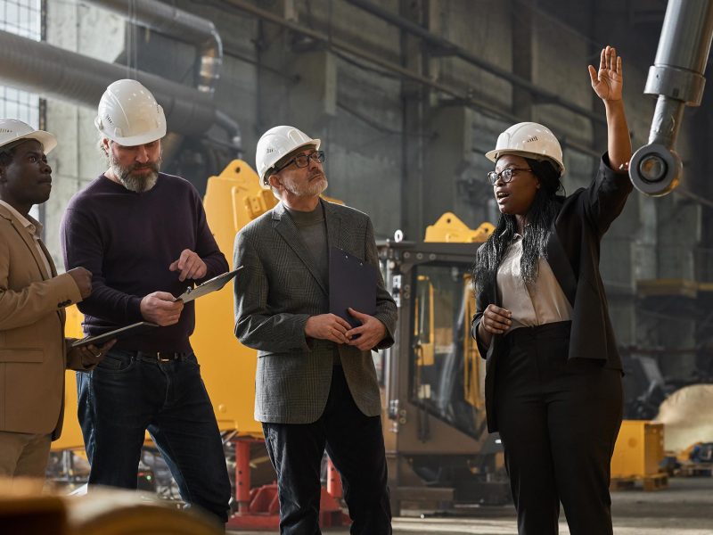 businesswoman-presenting-the-equipment-to-colleagu-2022-03-29-23-49-26-utc.jpg